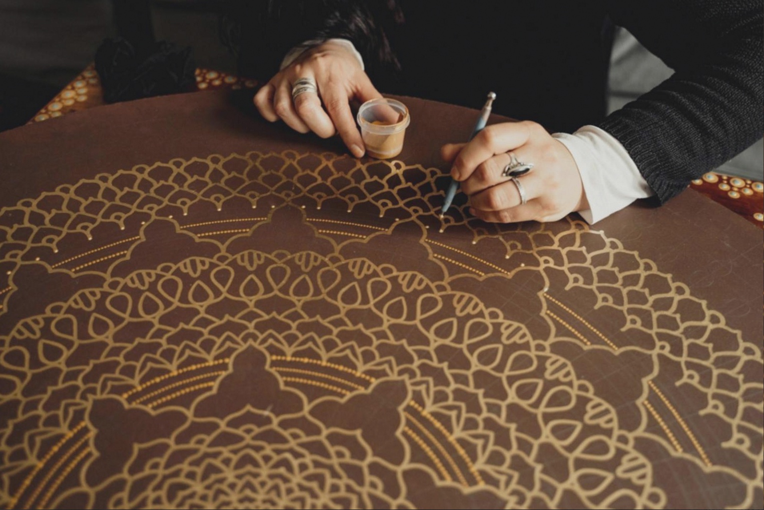 Concept artist working through visual development sketches at a studio desk